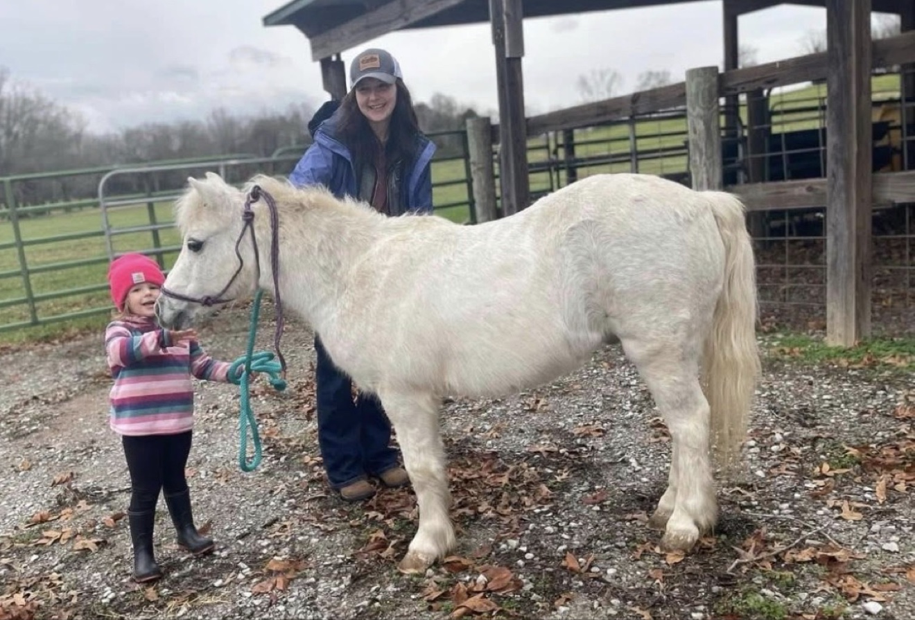 A Hayley Stables customer with a gray horse purchased from the stable