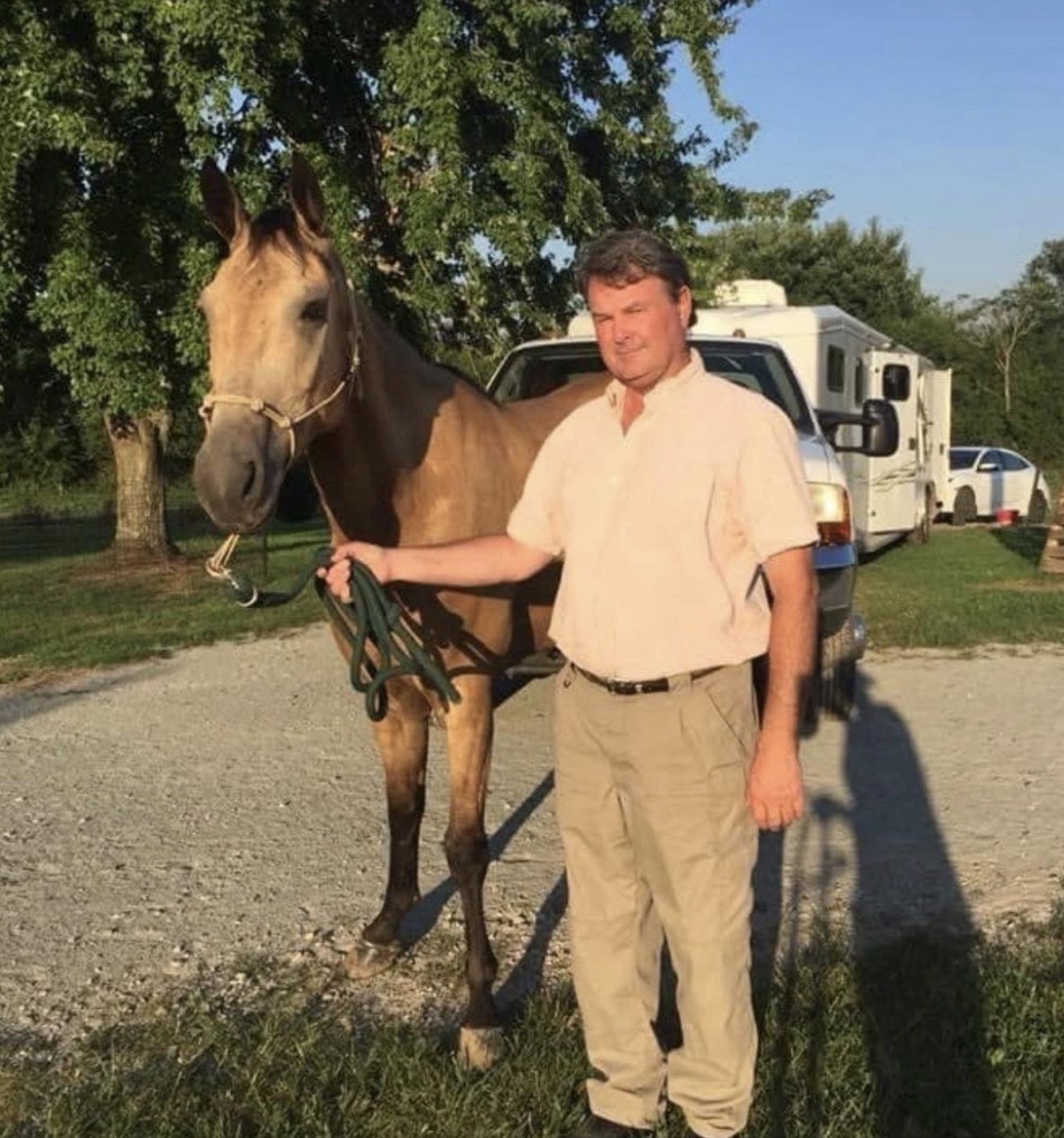 A Hayley Stables customer posing beside a purchased horse